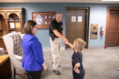 Constituent Kaley Bastine joins Senator Lindsey Williams for a tour of the Capitol Police facility. Kaley has raised over $10,000 for the Harrison Police Department in 2019.