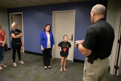 Constituent Kaley Bastine joins Senator Lindsey Williams for a tour of the Capitol Police facility. Kaley has raised over $10,000 for the Harrison Police Department in 2019.