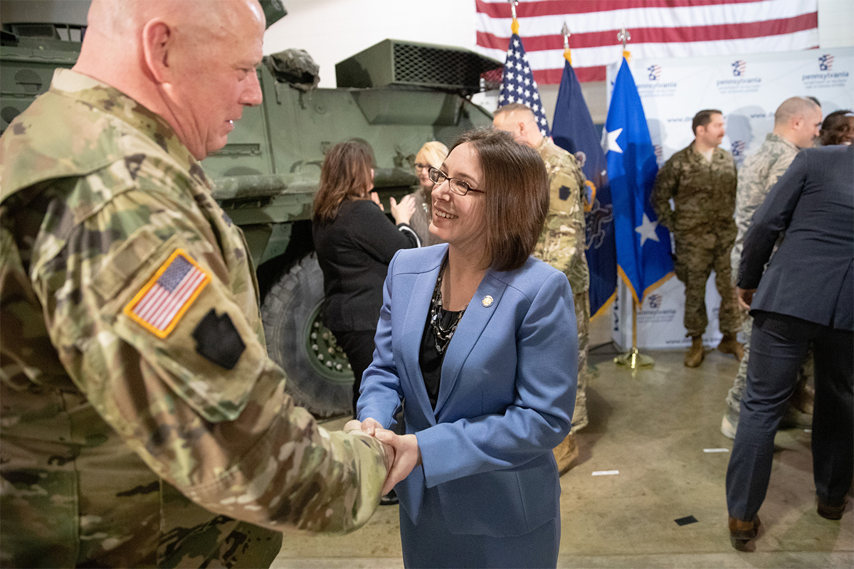 Senator Williams shakes hands with National Guard officer